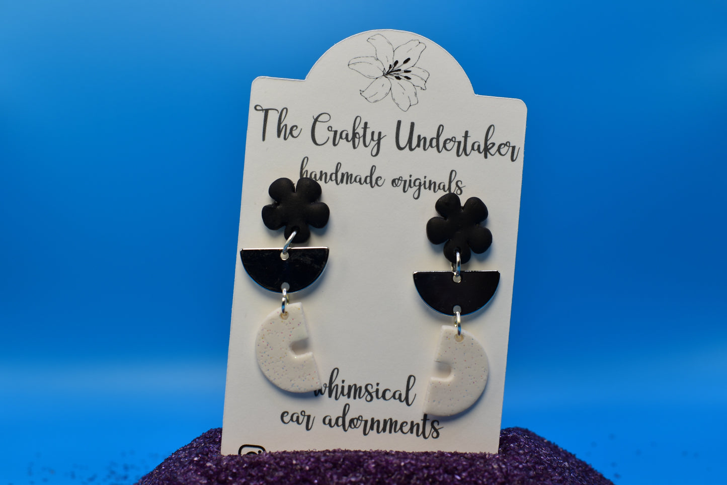 Black flower + silver + white shimmer arch