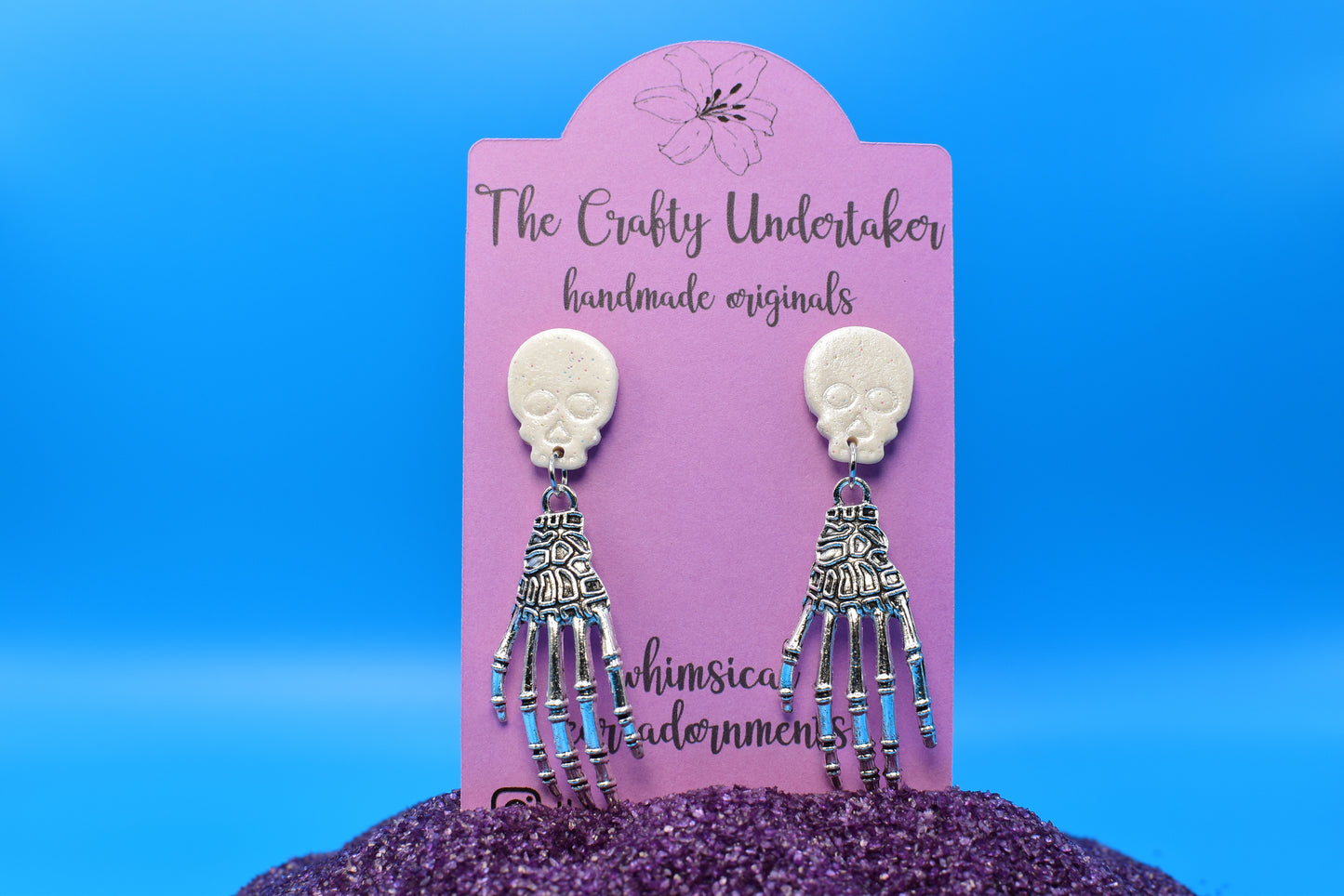 spooky brass skeleton hands + skull